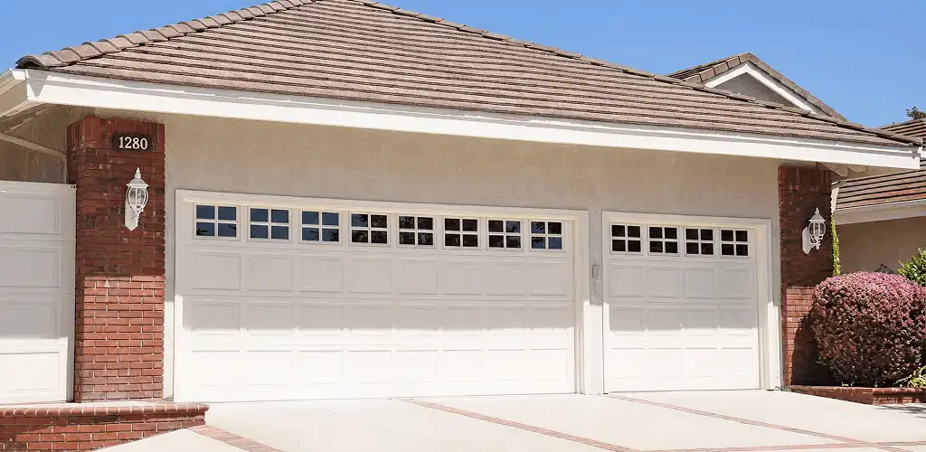 Residential garage door repair service for a double garage door in Ogden, UT