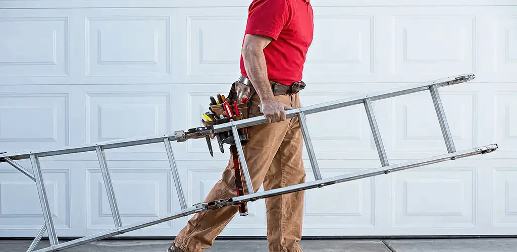 Garage door repair technician arriving with tools and ladder in Ogden, UT