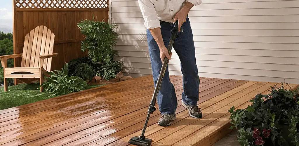 Deck staining service applying stain to a backyard wood deck in Ogden, UT